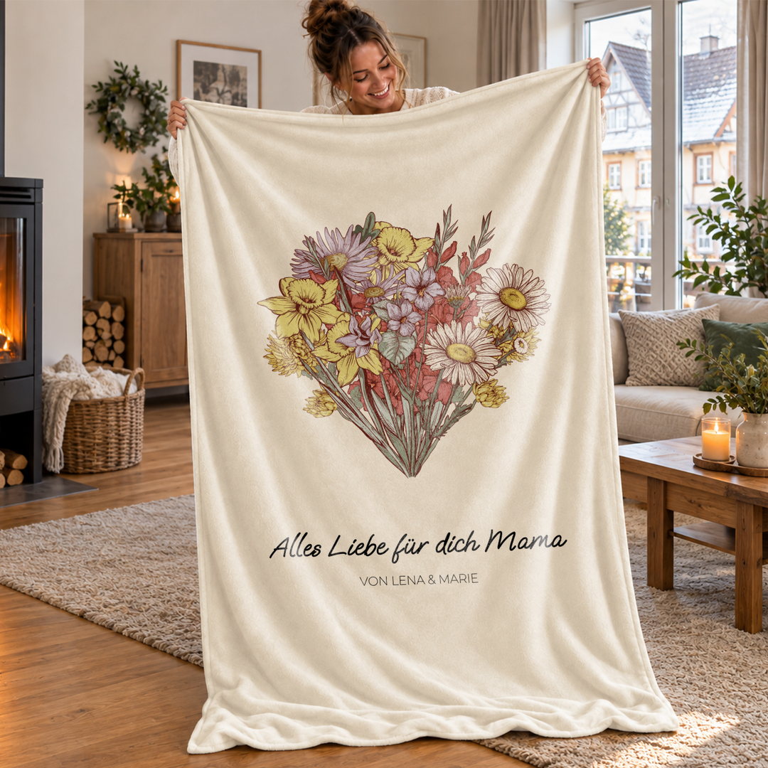 Frau hält Decke „Alles Liebe für dich Mama“