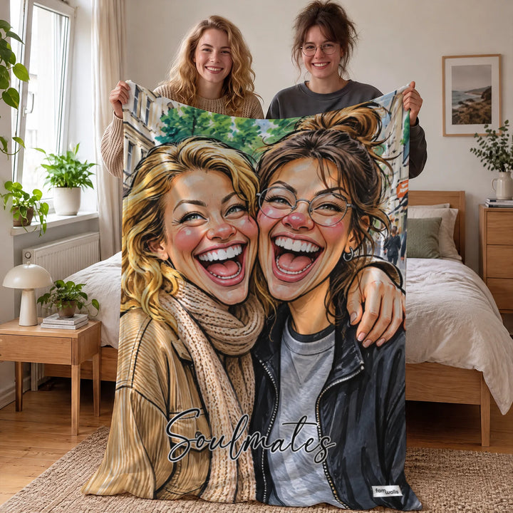 Zwei Freundinnen halten die Decke mit ihrer Illustration und dem Spruch Soulmates im Schlafzimmer hoch