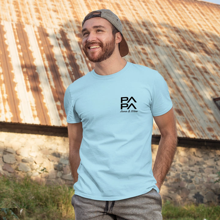 Man wearing a hat and personalized Papa T-Shirt Modern, smiling outdoors. T-shirt can display children's names, making it a heartfelt gift.